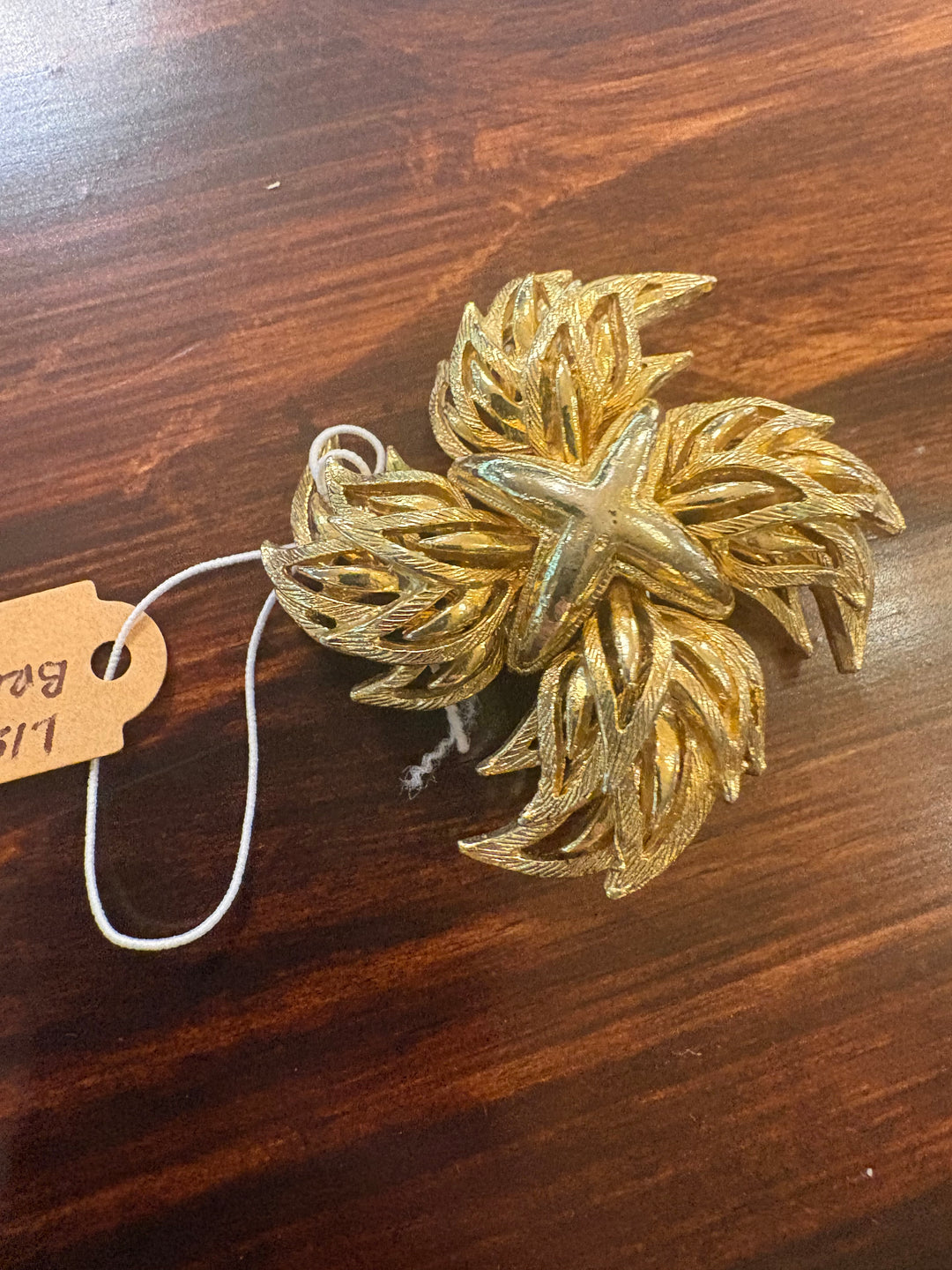 Linsner Gold Tone Pinwheel Brooch
